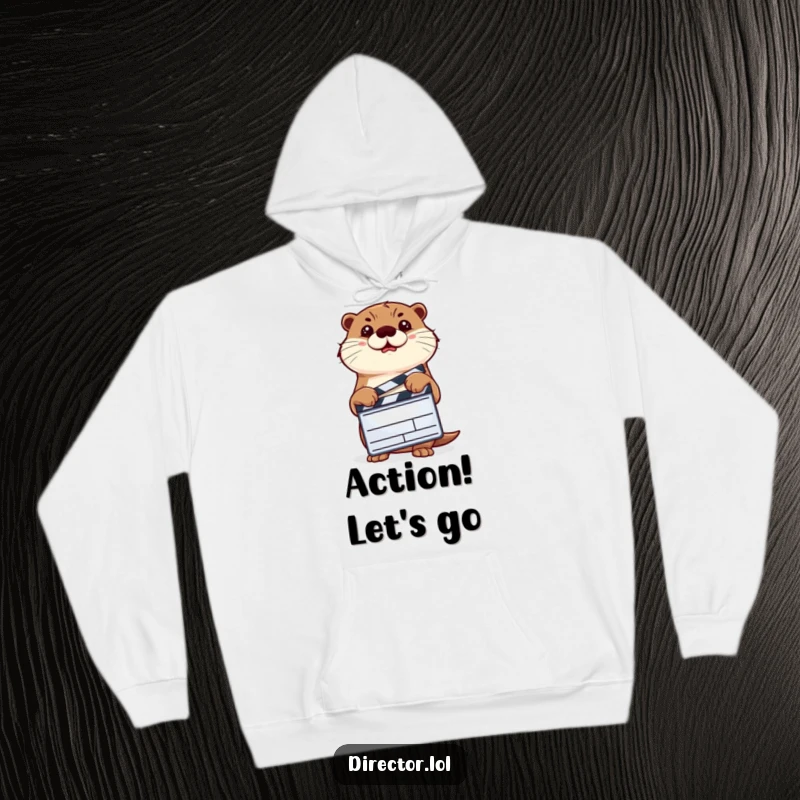 Funny determined otter holding a clapperboard and nodding, a humorous movie theme on a cozy hoodie.